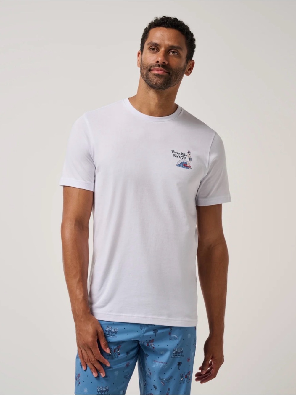 Travis Mathew White Short Sleeve Tee with Small Chest Graphic